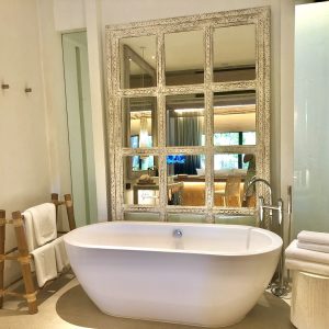 bathroom interior background and white spa towels on wood.